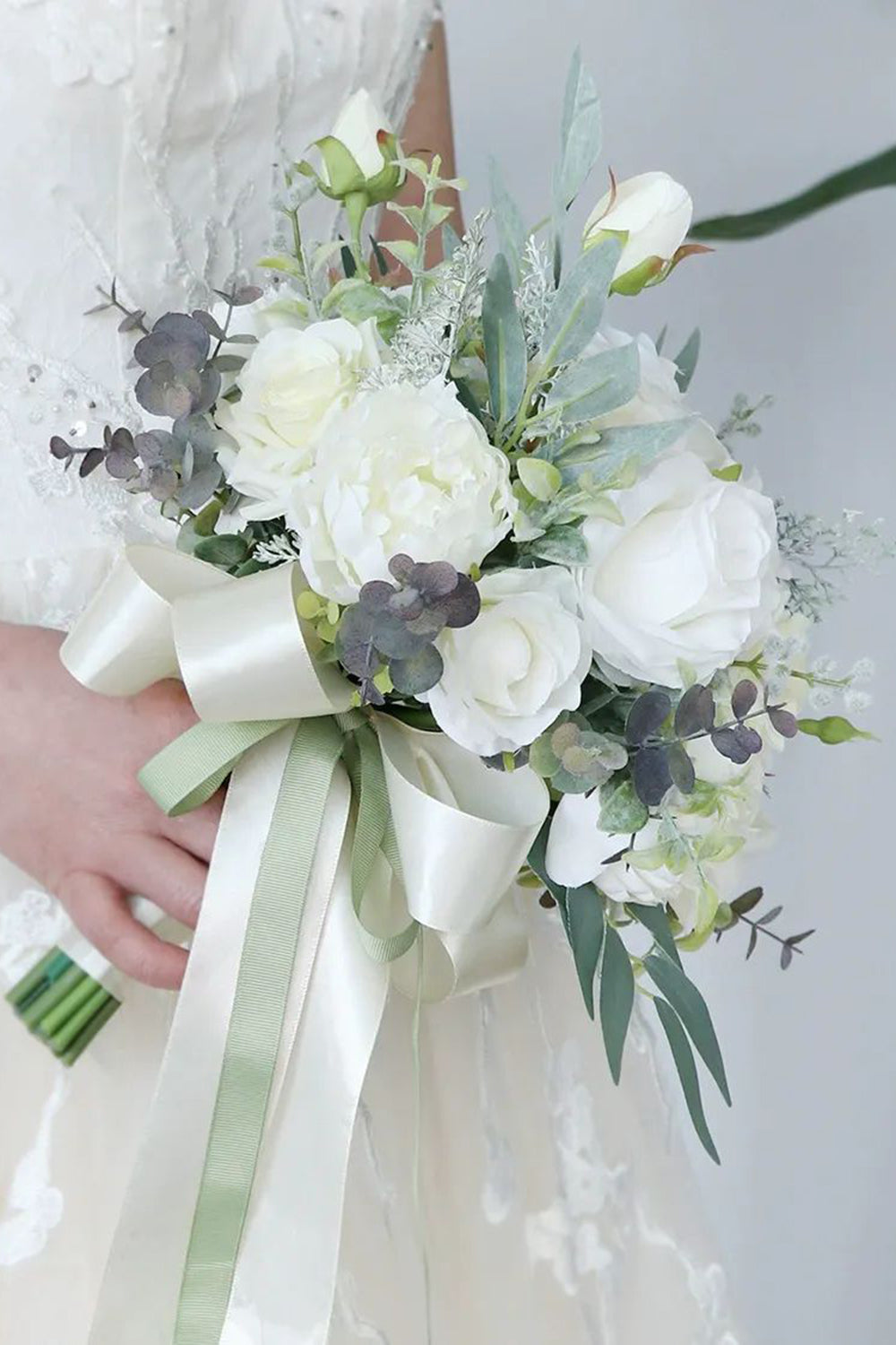 White Hand Holding Flower Bridal Bouquet with Bow