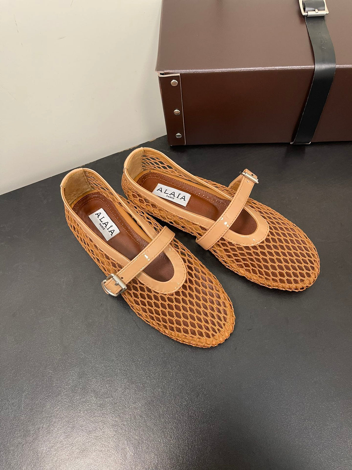 ALAIA BALLET FLATS IN COPPER BROWN MESH FISHNET